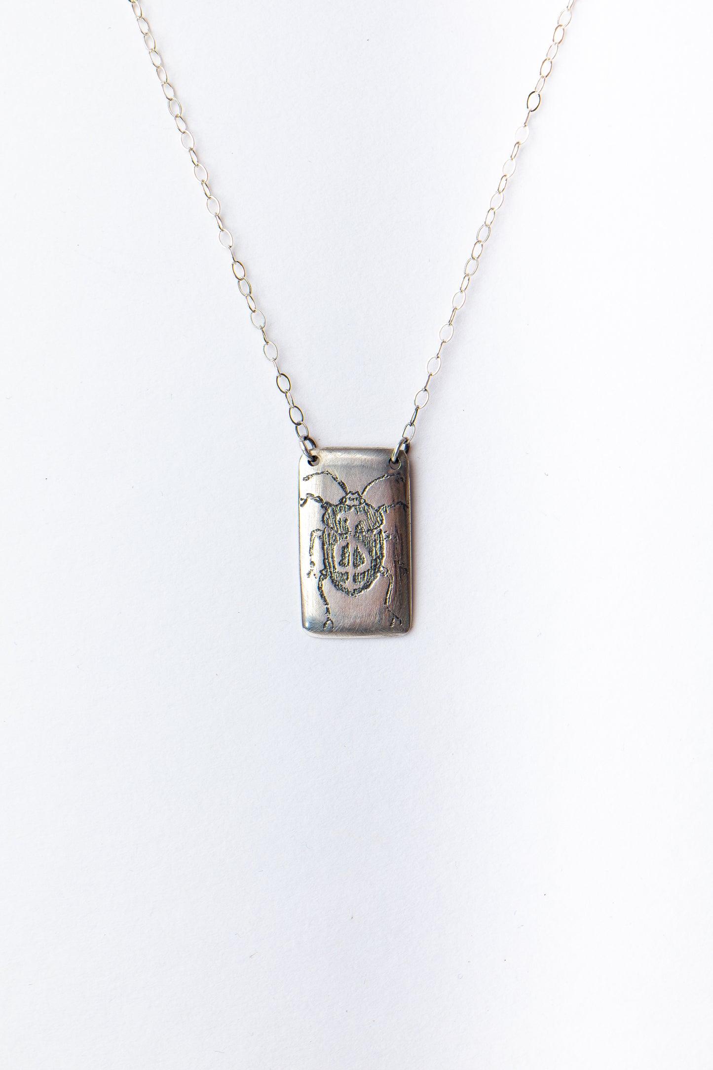 Silver Shield Bug Dog Tag