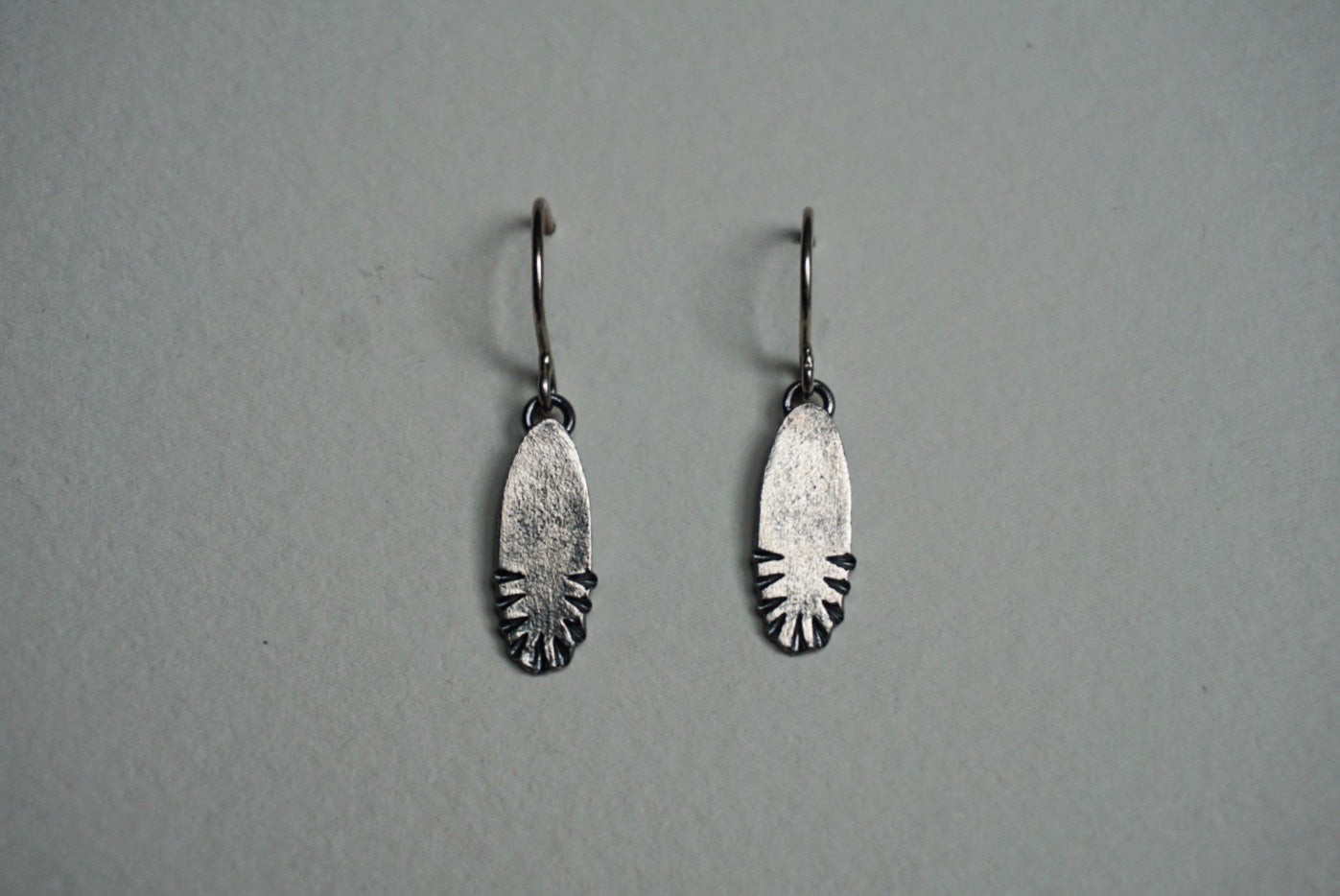 Small oval sterling silver ridge textured earring