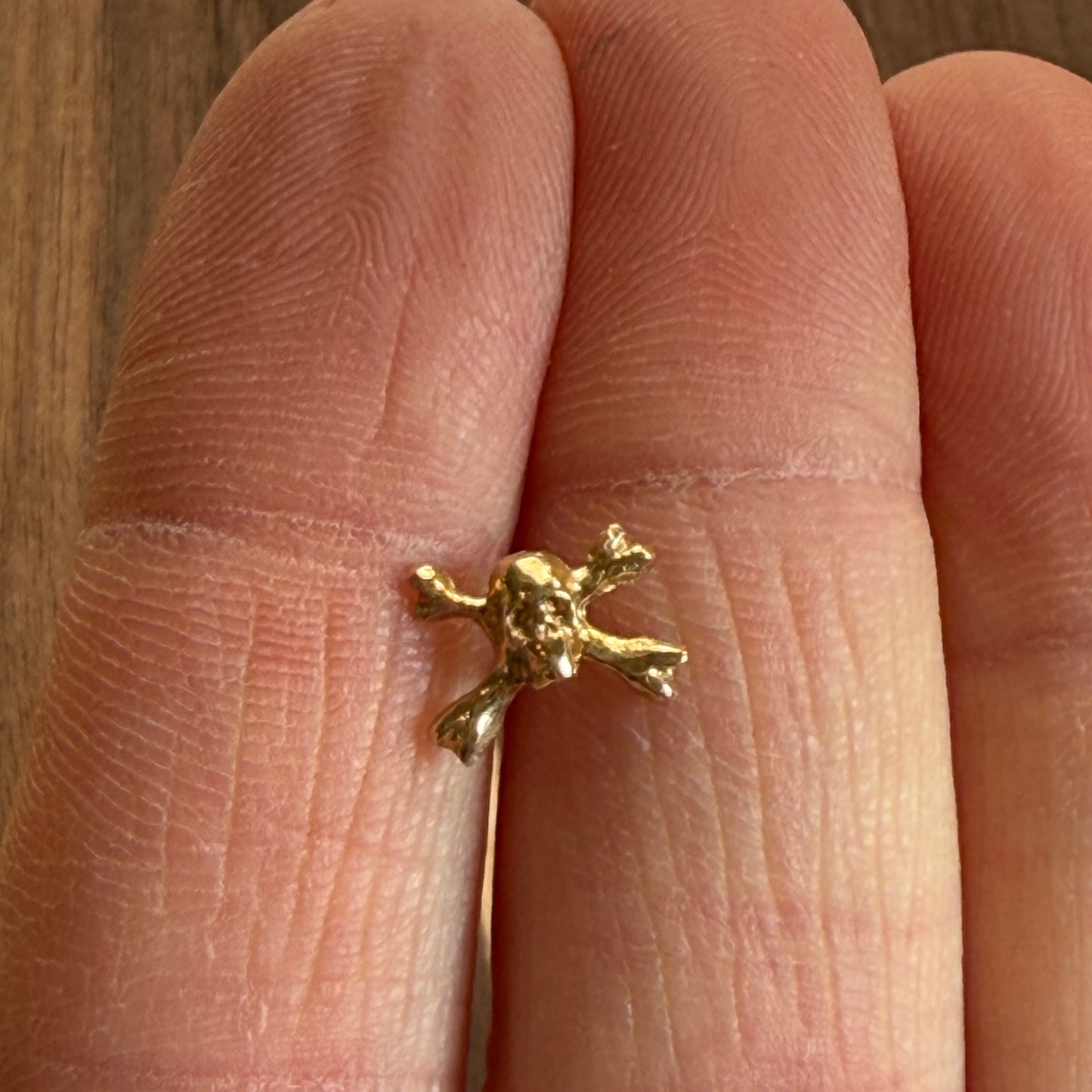 14k Crossed Bones Single Skull Stud
