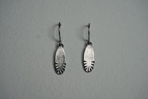 Small oval sterling silver ridge textured earring