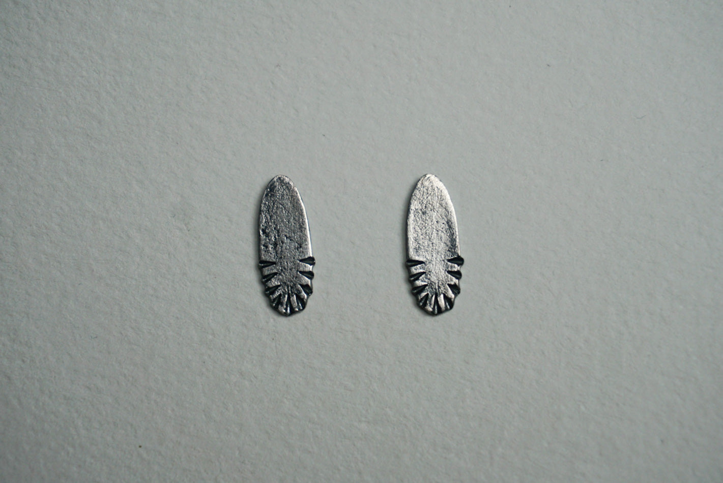 Small oval sterling silver ridge textured stud earring
