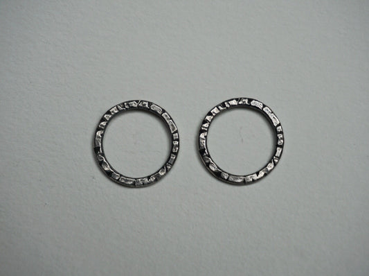 Textured sterling silver stud hoops.