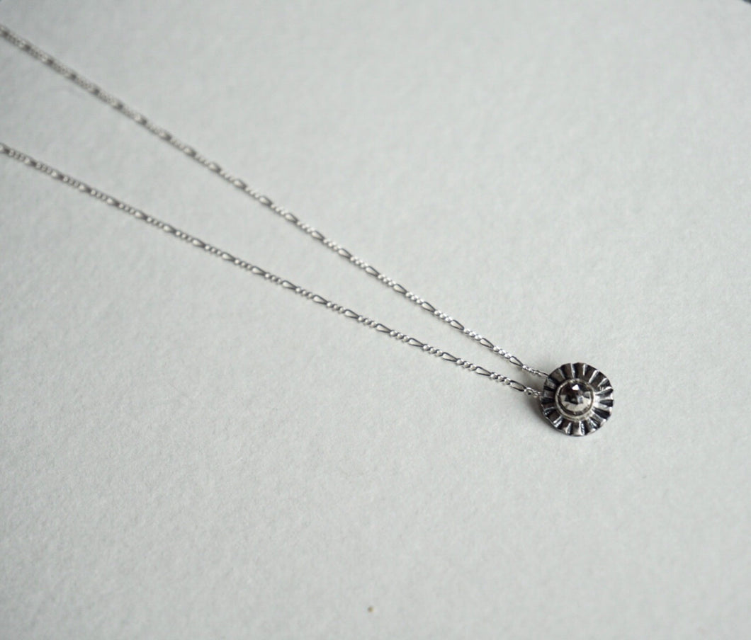 Small sterling silver ridge circle necklace with faceted pyrite