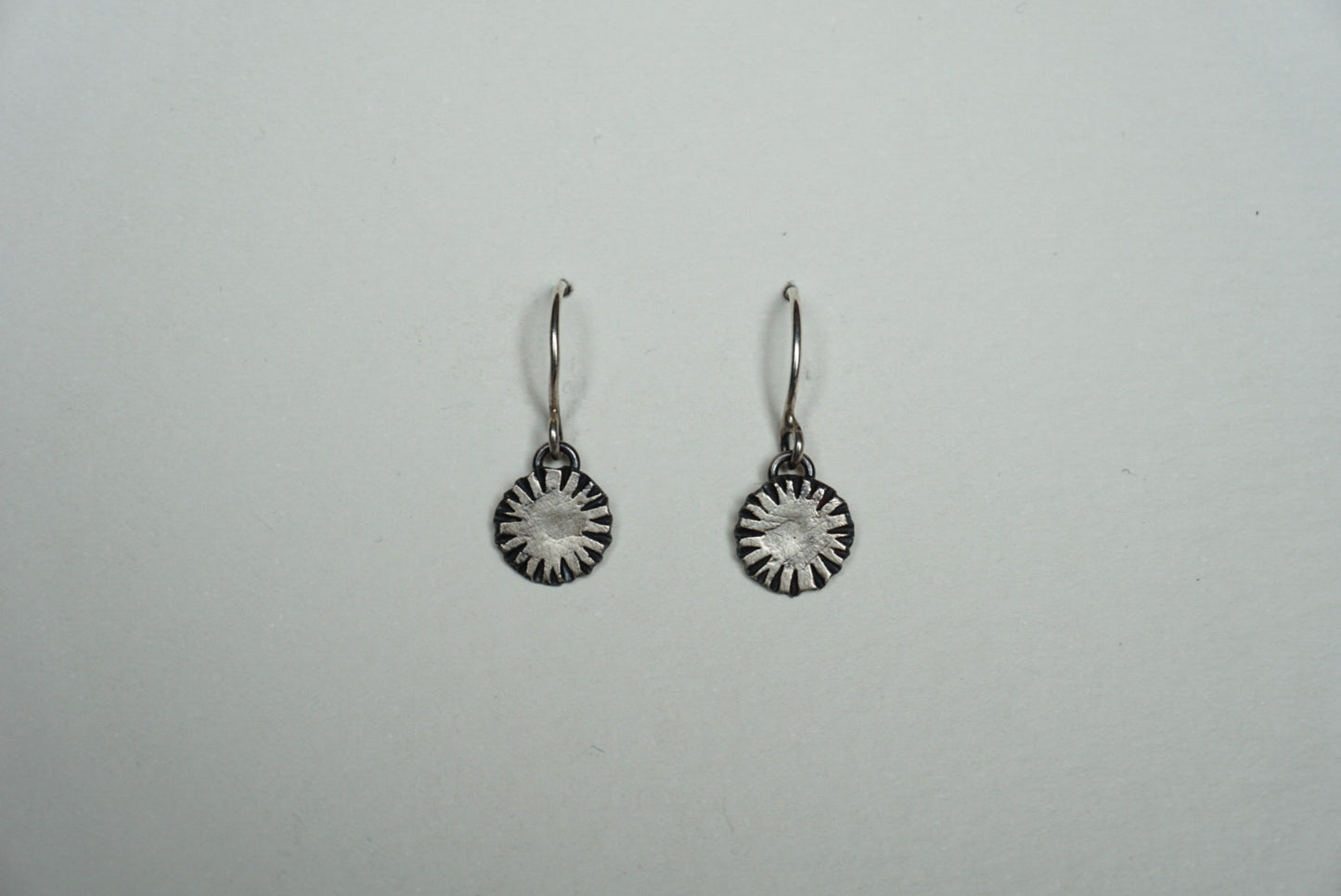 Small silver ridged circle drop earring