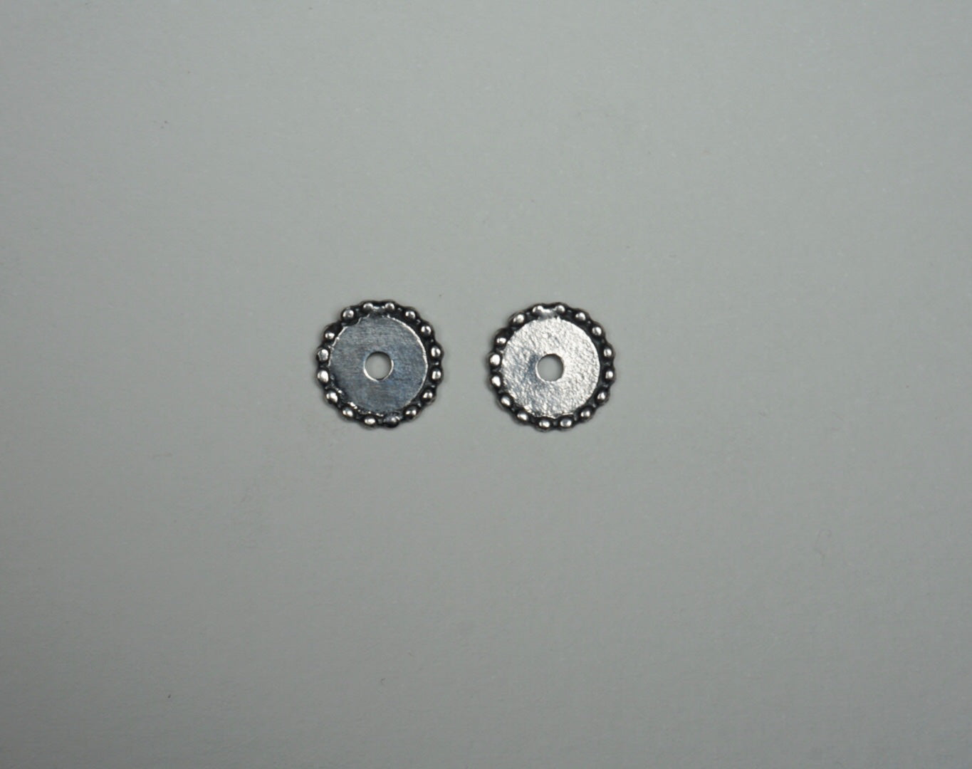 Sterling silver circle post earrings with outer dots