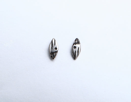 Small patterned ellipse silver studs