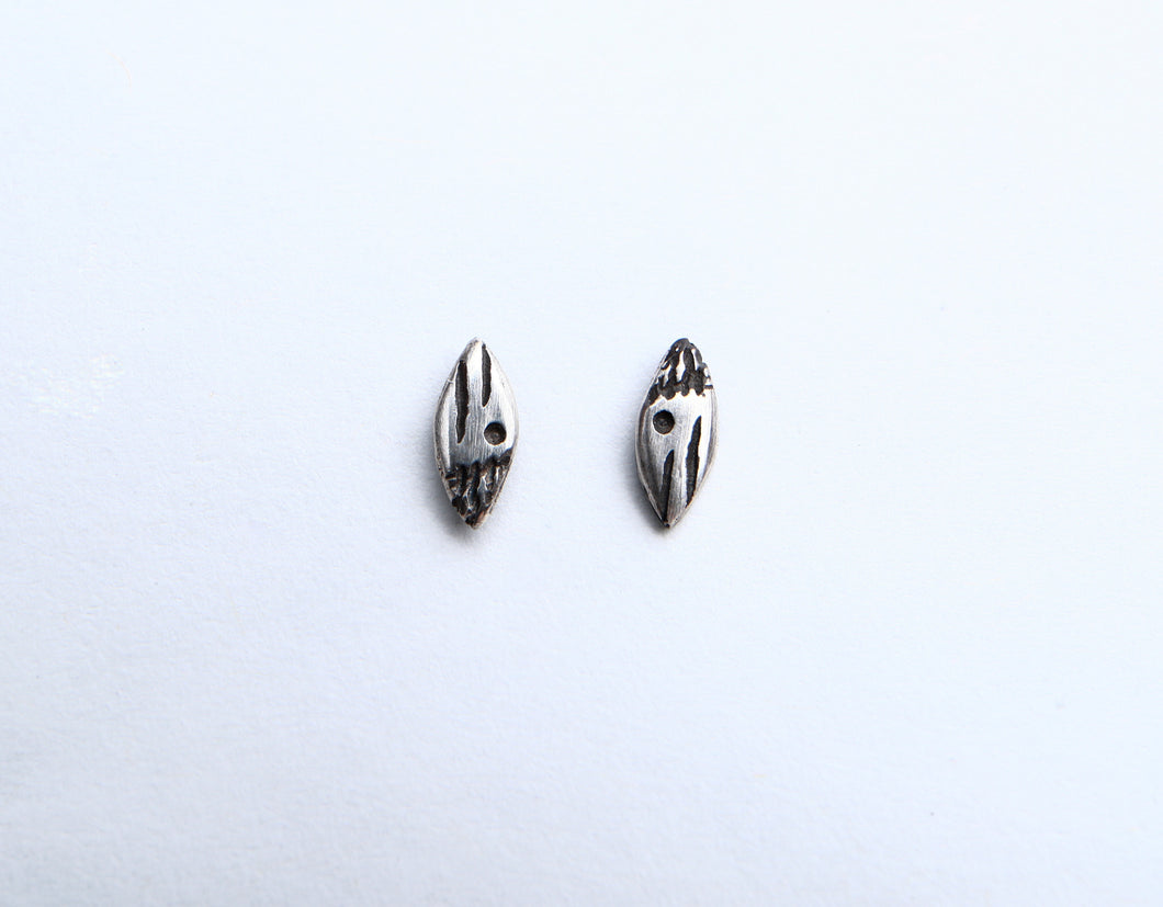 Small patterned ellipse silver studs